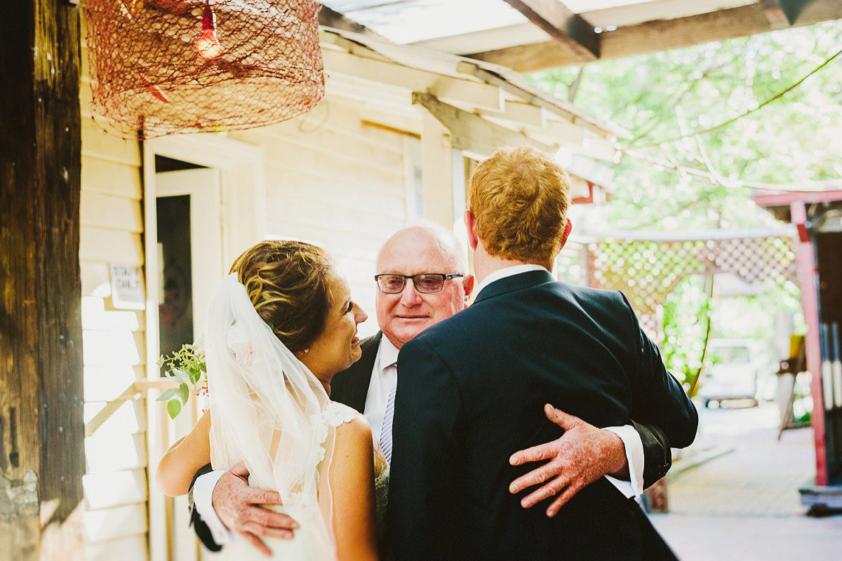 father and newlyweds at chapel farm