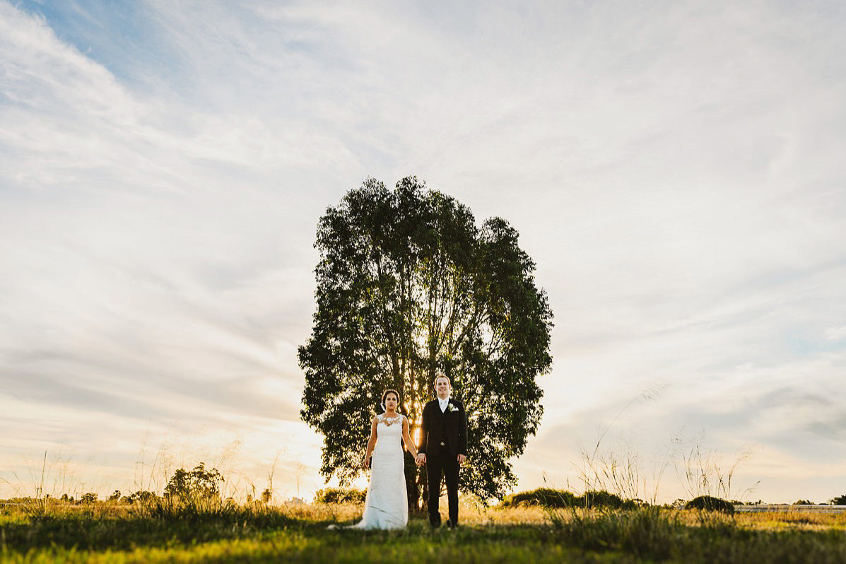 newlyweds in front of a caversham tree